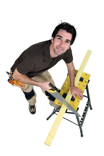 Carpenter sawing. — Stock Photo, Image