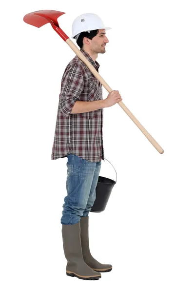 A construction worker with a shovel. — Stock Photo, Image