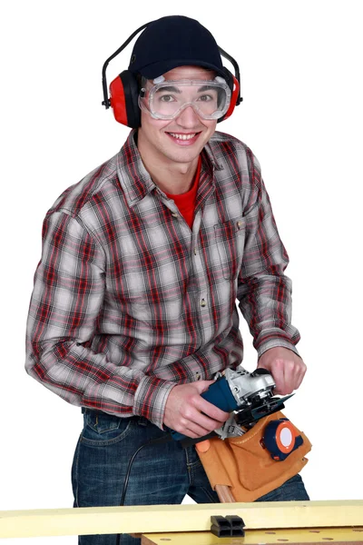 Homem segurando uma ferramenta elétrica — Fotografia de Stock