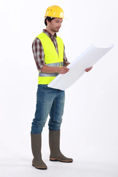 Foreman consulting blueprints — Stock Photo, Image