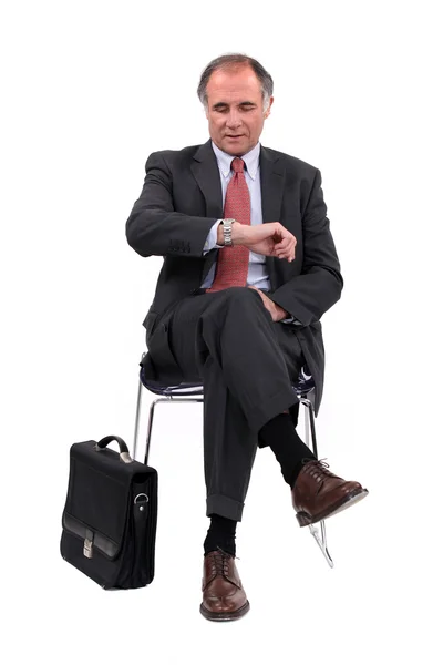 Businessman consulting his watch — Stock Photo, Image