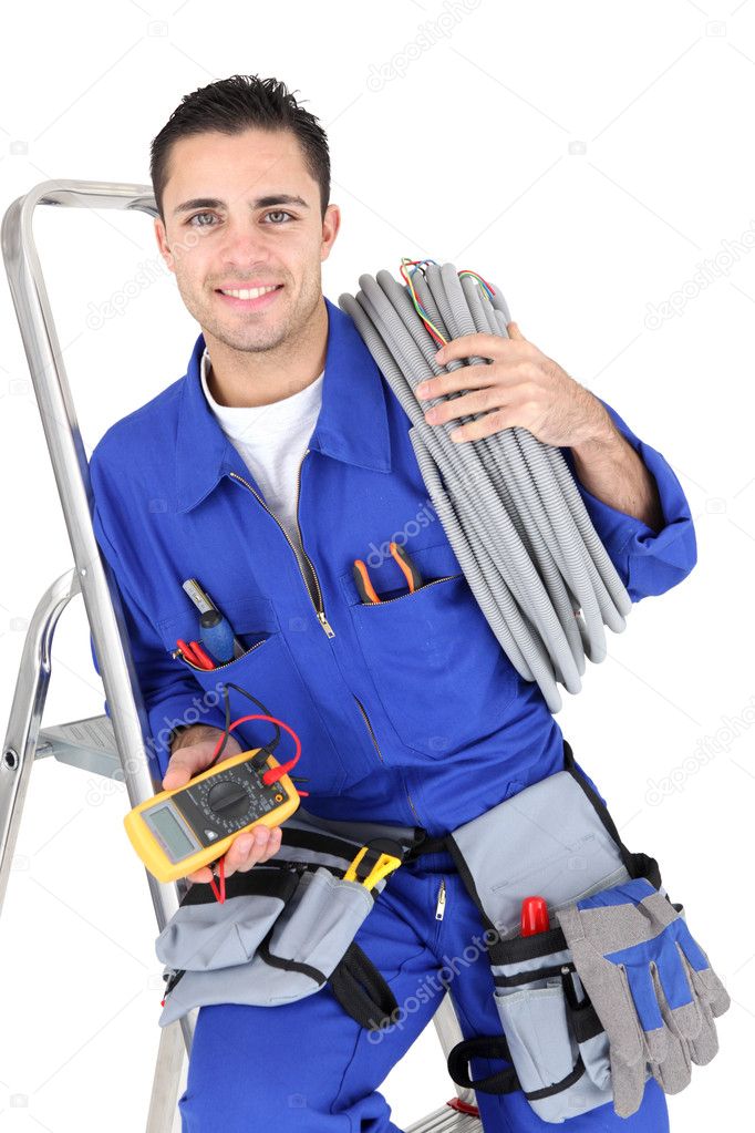 Electrician with a voltmeter and cable — Stock Photo © photography33