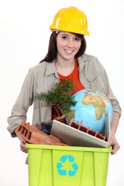 Tradeswoman taking out the recycling clipart