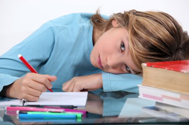 Child doing homework clipart