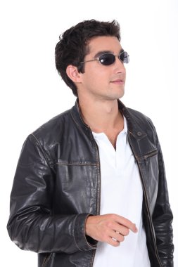 Young man wearing leather jacket and sunglasses clipart