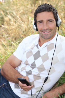 Man listening to music clipart