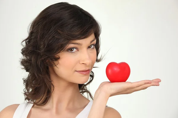Young woman holding a plastic hearth in her hand — Stock Photo, Image
