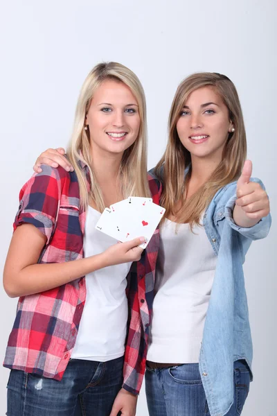 Teenage girls holding playing cards — Stock Photo, Image