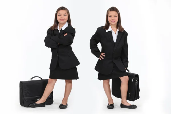 Écolières habillées en femmes d'affaires — Photo