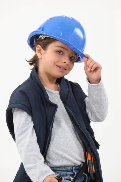 Malá holčička, oblečený jako stavební dělník — Stock fotografie