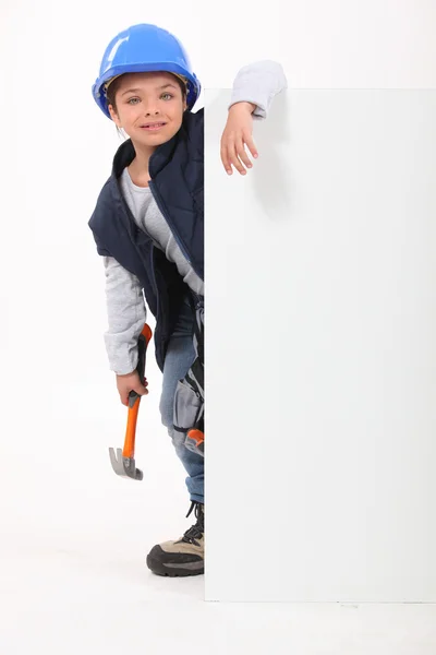 Kinderbouwer met een leeg bord voor uw bericht — Stockfoto