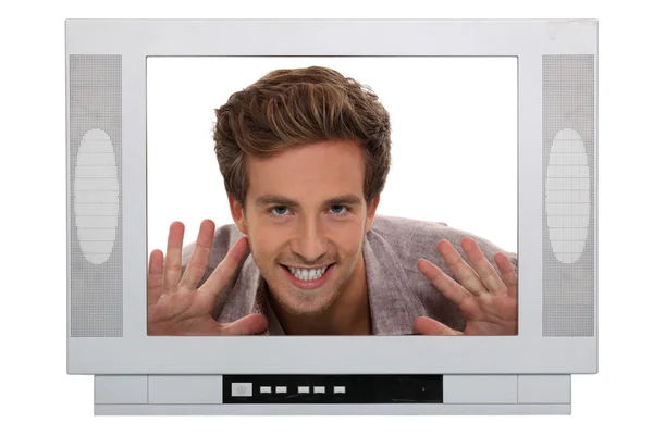 Estúdio da cabeça de um homem emoldurado por um aparelho de televisão — Fotografia de Stock
