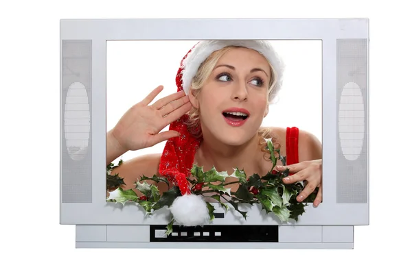 Mulher vestida com roupa de Natal, ficou na frente da TV falsa — Fotografia de Stock