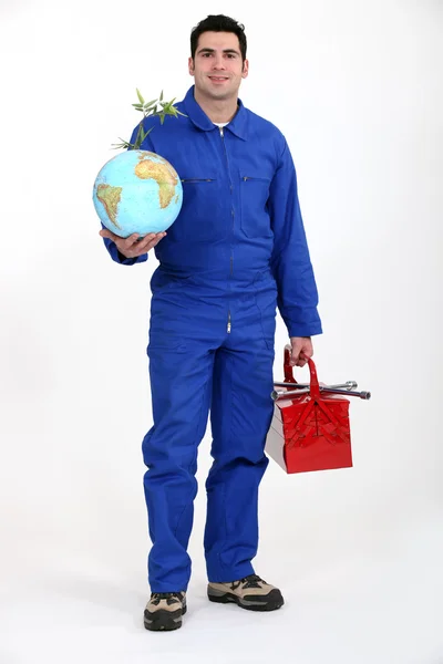Mann mit Werkzeugkiste und Globus — Stockfoto
