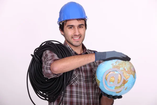 Elettricista tenendo globo — Foto Stock