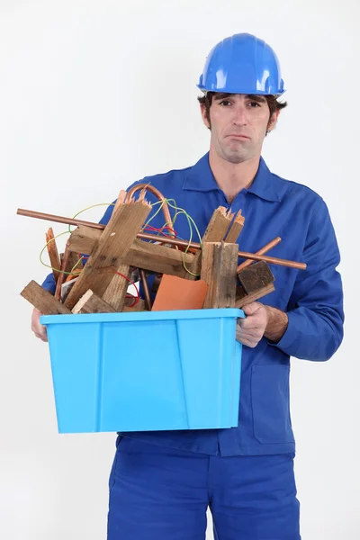 Construction worker recycling old wood — Stock Photo, Image