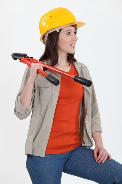 Craftswoman holding a spanner — Stock Photo, Image