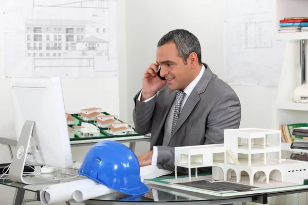 Real estate businessman working in his office — Stock Photo, Image