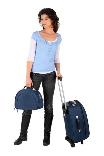 Mladá žena s zavazadla — Stock fotografie