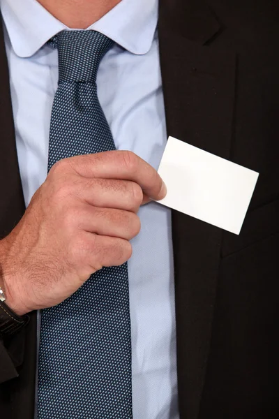 Man removing business card from pocket — Stock Photo, Image