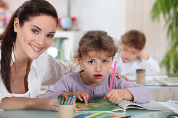 Teacher and her students Stock Photo