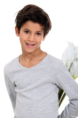 Little boy hiding a bunch of flowers in his back clipart