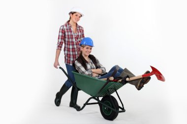 Two women with wheelbarrow clipart