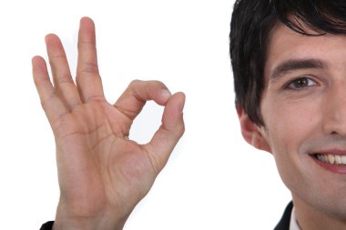 Man giving the a-ok hand gesture clipart