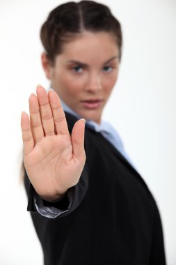 Businesswoman making stop gesture clipart