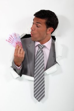 Businessman surprised at his windfall clipart