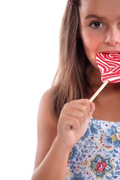 Little girl with a red and white lolly — Stock Photo, Image