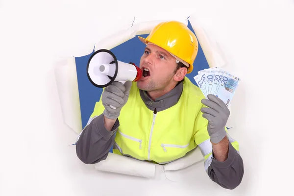 Construction worker with megaphone and money — Stock Photo, Image