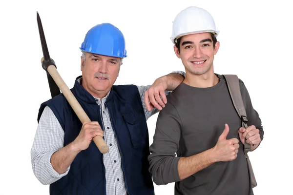 A construction worker teaching his job. — Stock Photo, Image