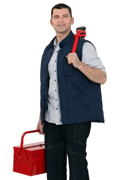 Trabajador ocasional que lleva llave inglesa y caja de herramientas —  Fotos de Stock