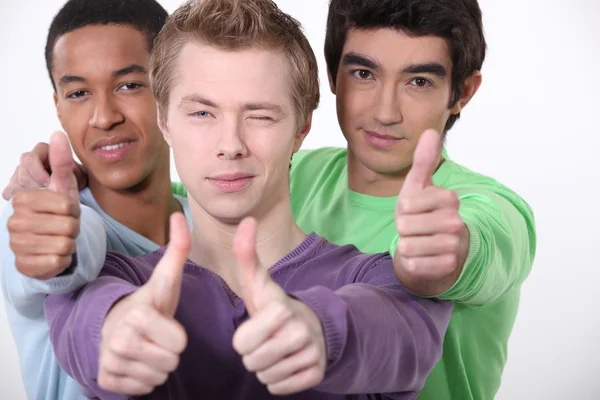 Young men with thumbs up — Stock Photo, Image