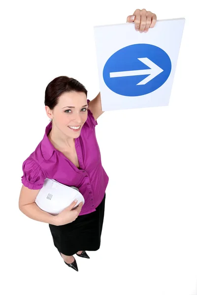 Woman showing road sign of obligation to turn right — Stock Photo, Image