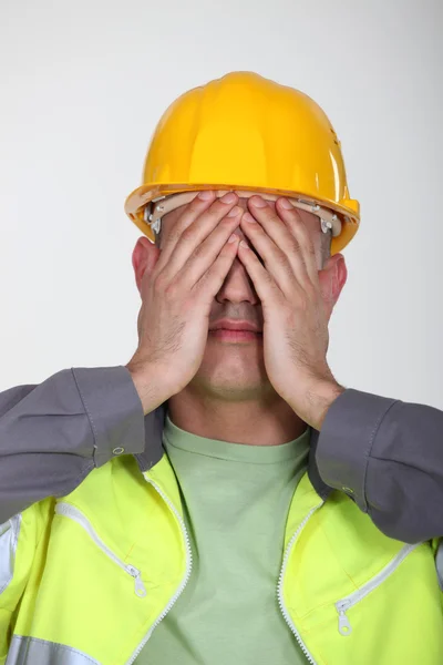 Craftsman with hands on his face — Stock Photo, Image