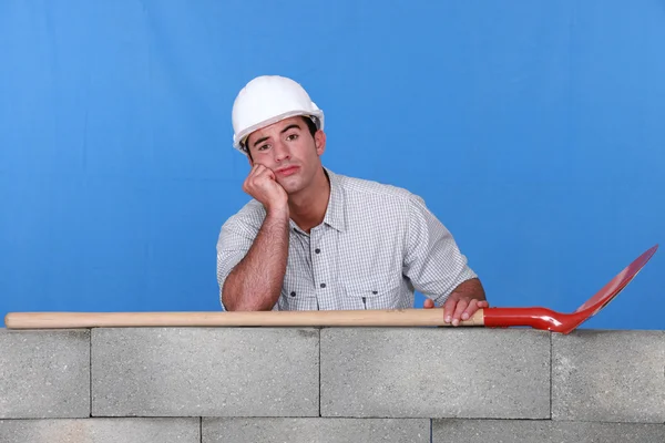 Unatkozó builder — Stock Fotó