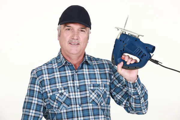 Handyman segurando um quebra-cabeça — Fotografia de Stock