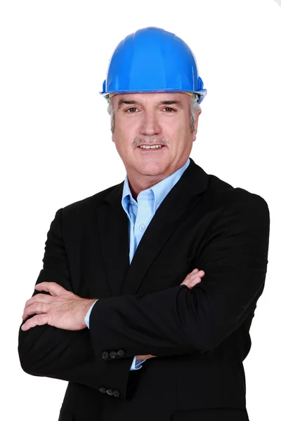 Senior businessman wearing a helmet — Stock Photo, Image