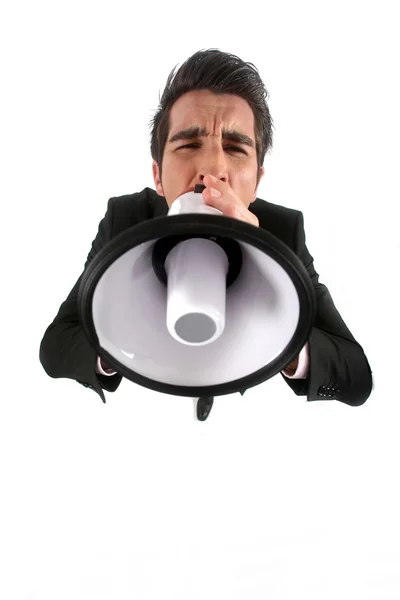 Businessman shouting through megaphone — Stock Photo, Image
