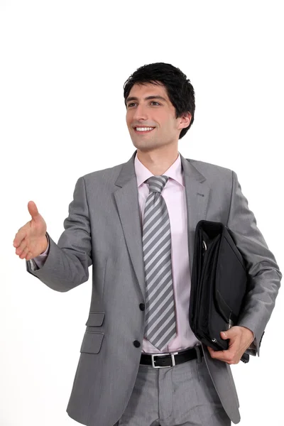 Businessman holding his hand out for a handshake — Stock Photo, Image