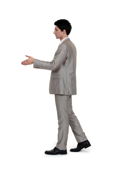 Geschäftsmann beim Händeschütteln allein auf weißem Hintergrund — Stockfoto