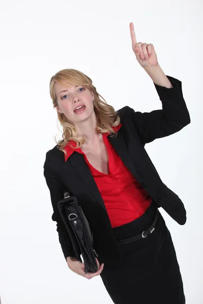 Businesswoman hailing a cab — Stock Photo, Image