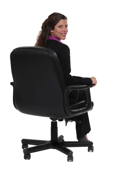 Business professional sitting in a swivel chair — Stock Photo, Image