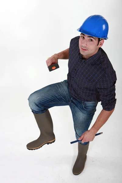Trabalhador da construção civil em botas wellington — Fotografia de Stock