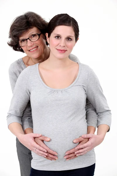 Pregnant woman stood with mother — Stock Photo, Image