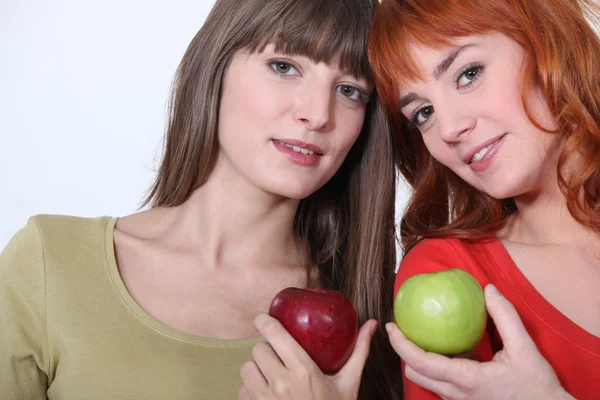 Girls holding apples Stock Photo