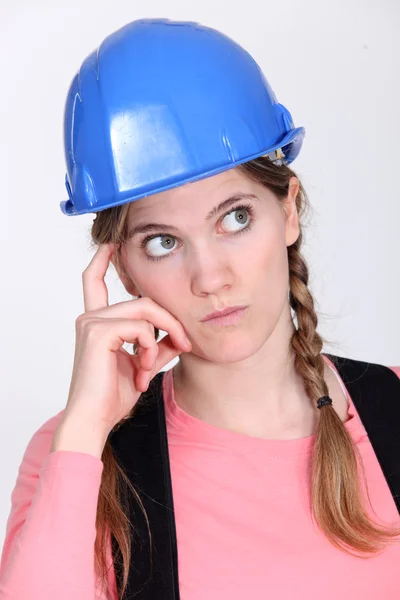 Pensive tradeswoman Royalty Free Stock Images