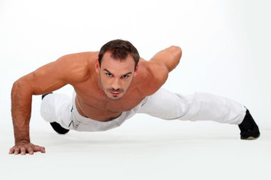 Man doing one-armed push-up clipart